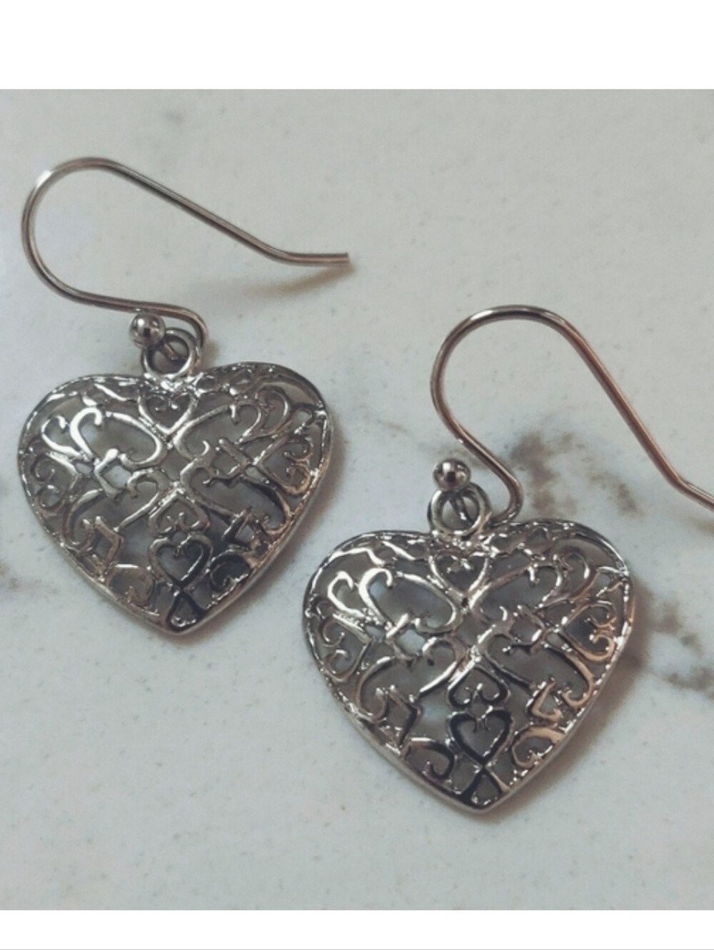 New platinum heart earrings.